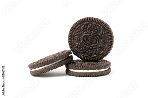 Biscuits chocolate  with crumbs on white background. It is a chocolate cookies with a sweet cream.