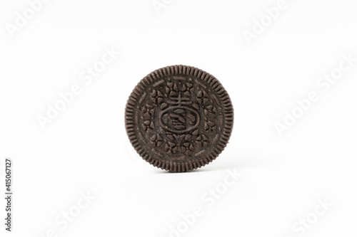 Biscuits chocolate  with crumbs on white background. It is a chocolate cookies with a sweet cream.