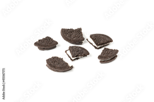 Biscuits chocolate  with crumbs on white background. It is a chocolate cookies with a sweet cream.