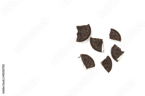Biscuits chocolate  with crumbs on white background. It is a chocolate cookies with a sweet cream.