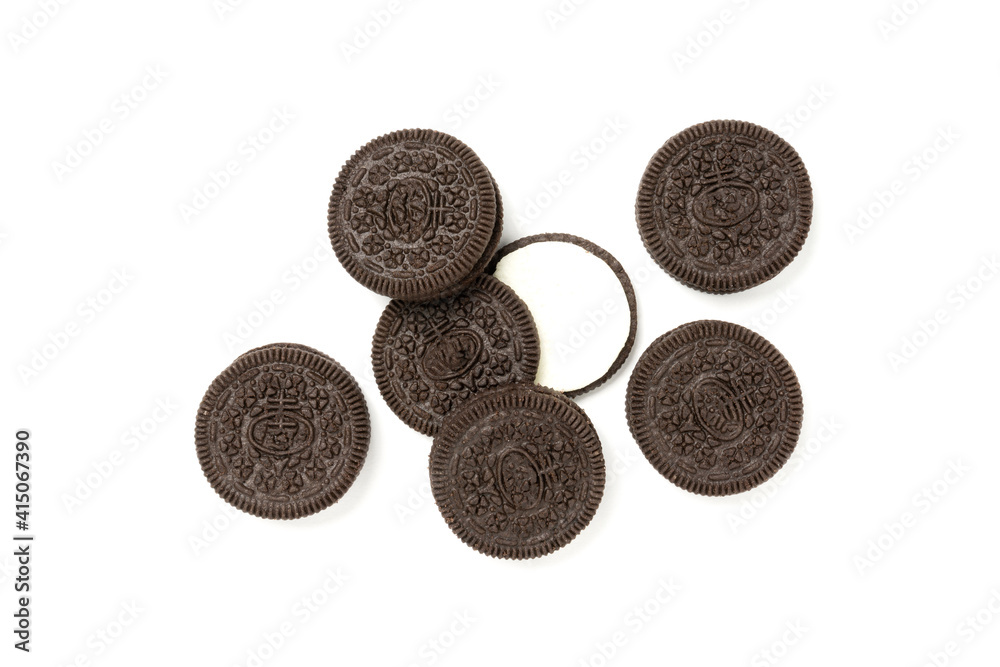 Biscuits chocolate  with crumbs on white background. It is a chocolate cookies with a sweet cream.