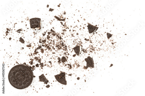 Biscuits chocolate  with crumbs on white background. It is a chocolate cookies with a sweet cream.