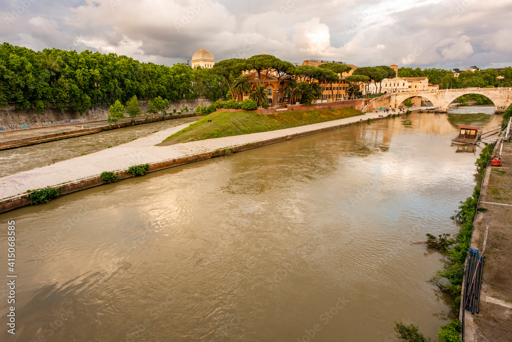 Italy, Rome. Tiber River, Tiber Island with Fatebenefratelli Hospital, and Ponte Cestius. Italy, Rome. Tiber River, Tiber Island with Fatebenefratelli Hospital, and Ponte Cestius.
