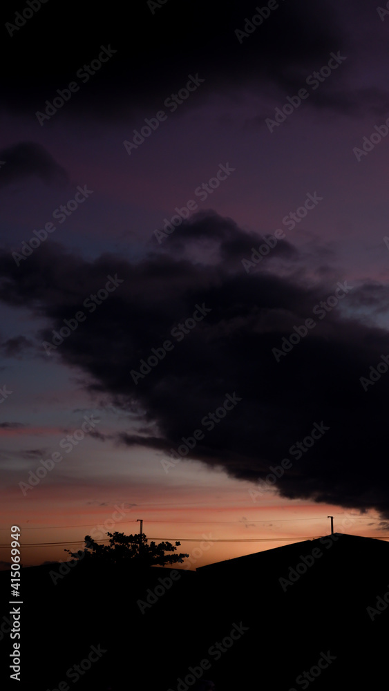 Pastel Sky Gradient Clouds during Dawn with Building Silhouette