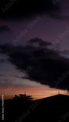 Pastel Sky Gradient Clouds during Dawn with Building Silhouette