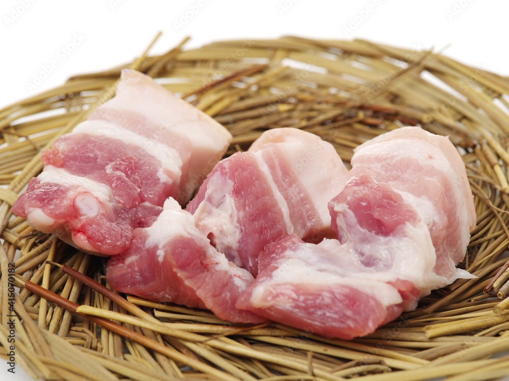 Raw pork belly pieces on a white background Raw pork belly pieces on a white background