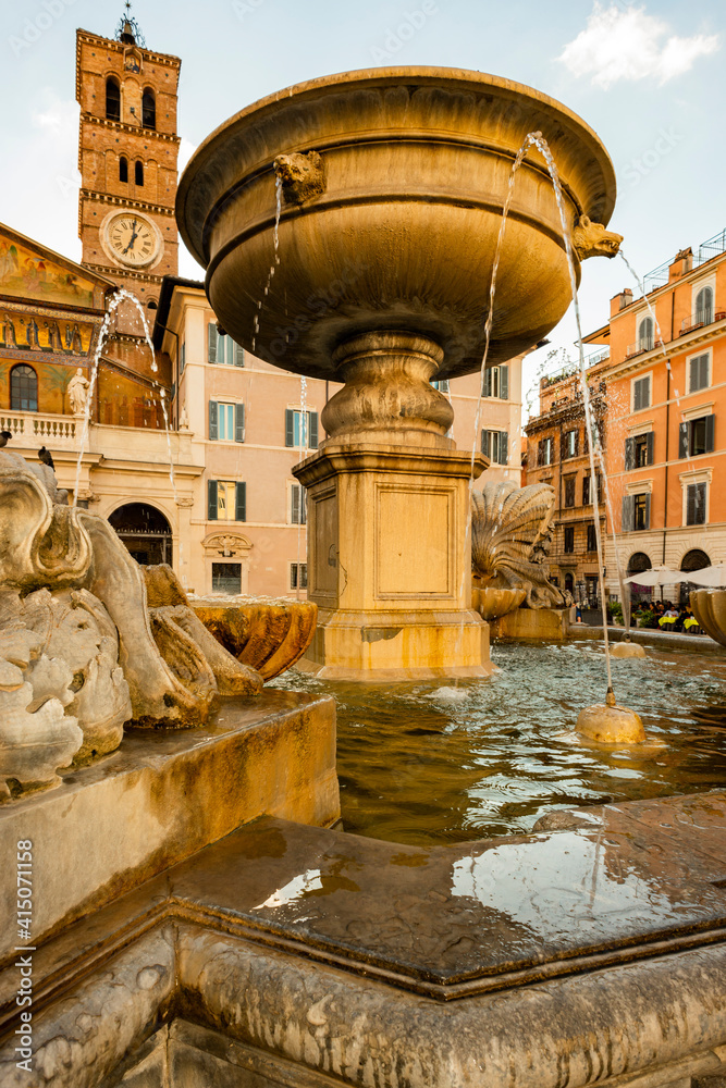 Italy, Rome. Piazza di Santa Maria di Trastevere, 8th century medieval-style fountain restored in 1658-94 by Donato Bramante and 1873 (said to be oldest in Rome).