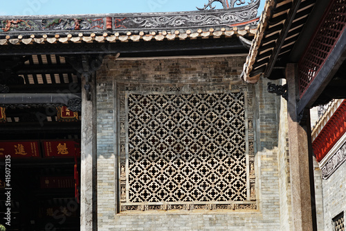   Foshan city, China. Fengjian Water Township. Shawan Ancient Town of Panyu, the place with 800 years of history. A window in Hezhi Lianggong Ancestral Hall (1875–1908) photo