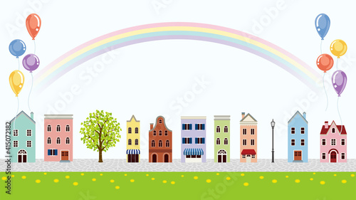 Old style townscape with balloons and rainbow