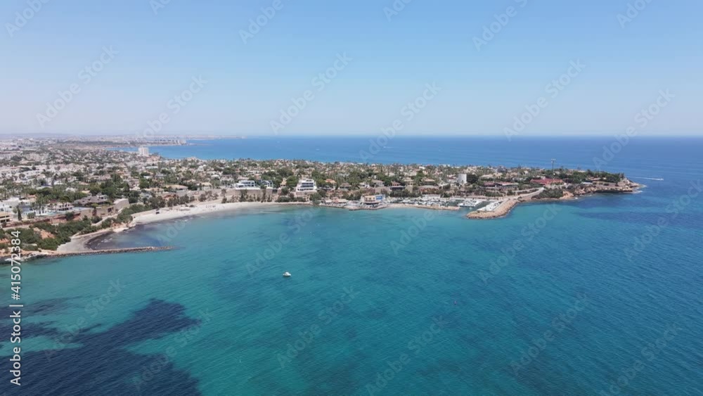 Beach and yacht club in Cabo Roig Alicante, southeast of spain. Drone footage in 4K and 60 fps for slow motion. Beach and yacht club in Cabo Roig Alicante, southeast of spain. Drone footage in 4K and 60 fps for slow motion.