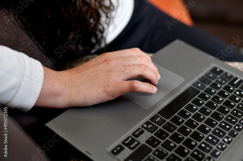 Using laptop, in home office due to pandemic