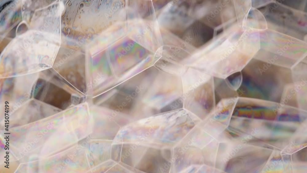 Soap bubbles appear on black background. Close-up macro shot Soap bubbles appear on black background. Close-up macro shot