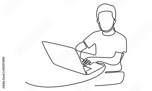 Continue line of man at his desk is working on the laptop computer