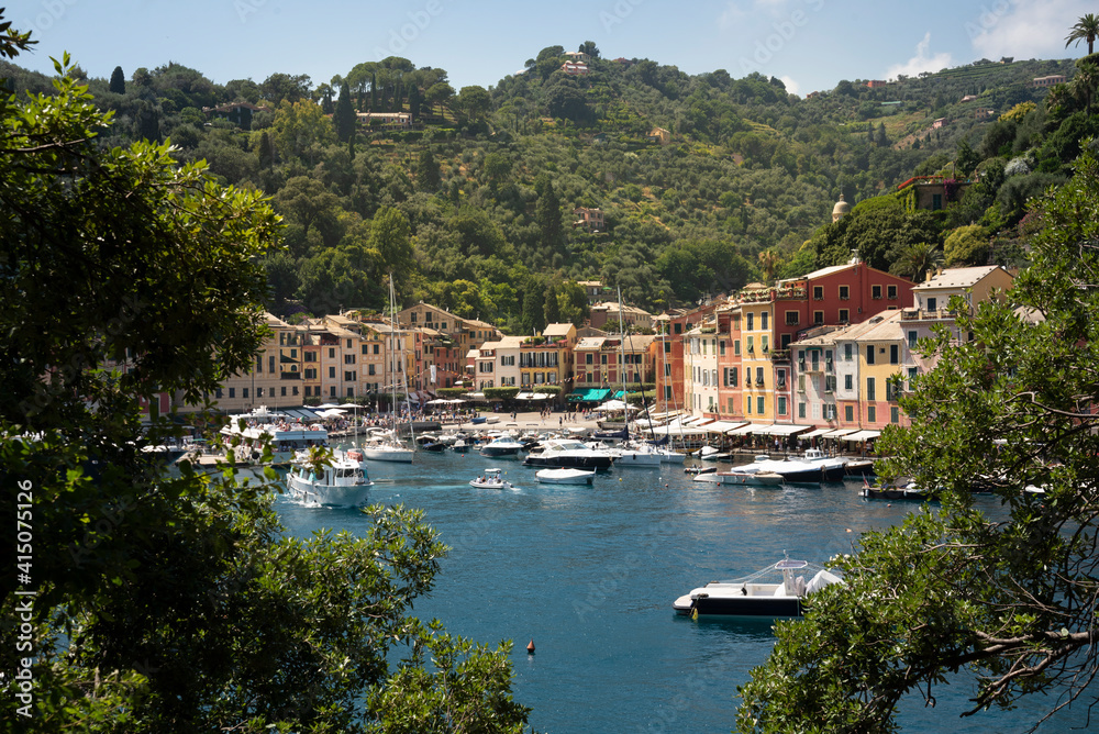 Italy, Genoa province, Portofino. Upscale fishing village on the Ligurian Sea, pastel buildings overlooking harbor