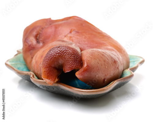 cooked the face of the pig on white background photo