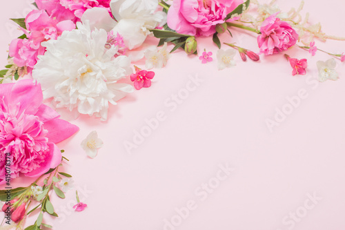 beautiful flowers on pink paper background © Maya Kruchancova