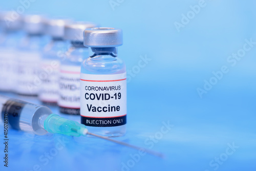 Vaccine and Healthcare Medical concept. Vaccines and syringe on blue background for prevention,immunization and treatment from corona virus infection