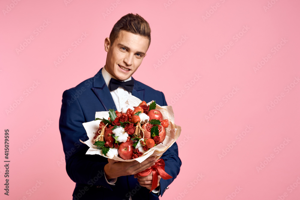 man in a suit bouquet of flowers romance date pink background man in a suit bouquet of flowers romance date pink background