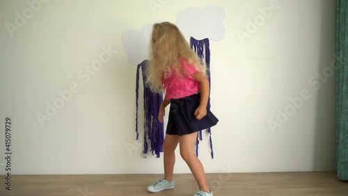 Happy 4 year old girl dancing in room at home. Gimbal motion
