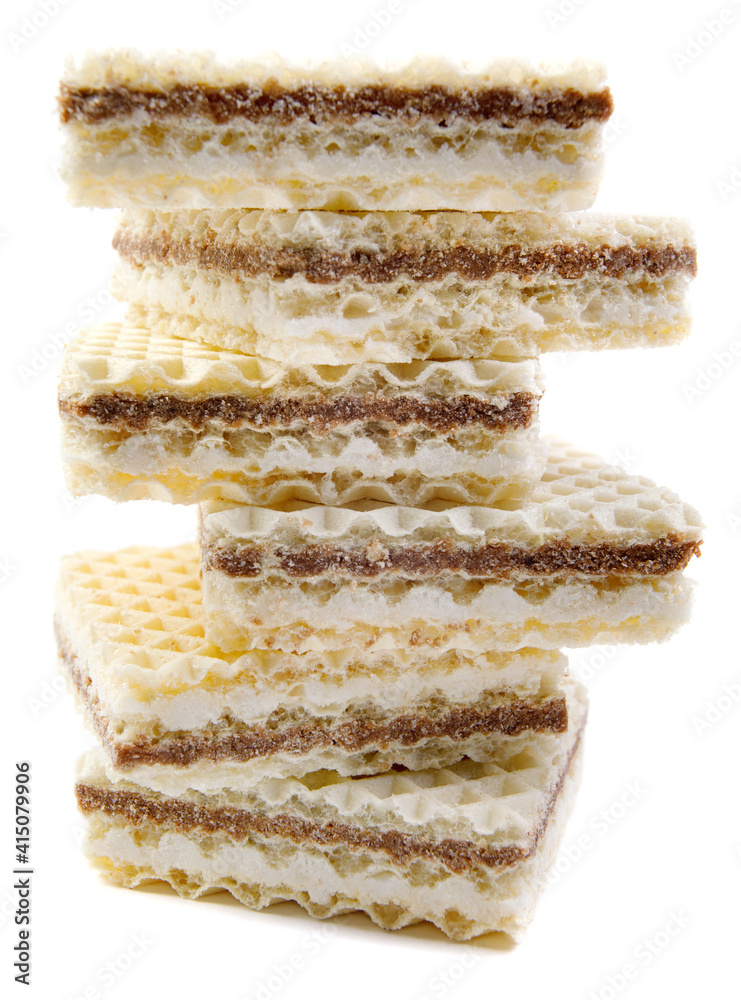 Fototapeta premium A high stack of delicious waffles is isolated on a white background.