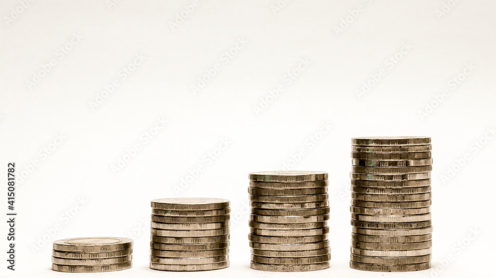 Business growth concept,Financial growth,Increasing piles of coins isolated on white background Business growth concept,Financial growth,Increasing piles of coins isolated on white background