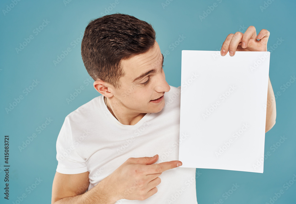 man with flyer in hand and mockup blue background cropped view man with flyer in hand and mockup blue background cropped view