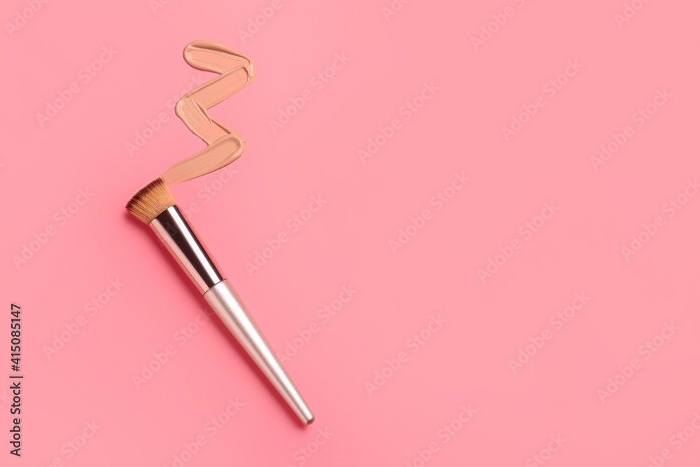Sample of makeup foundation and brush on color background Sample of makeup foundation and brush on color background