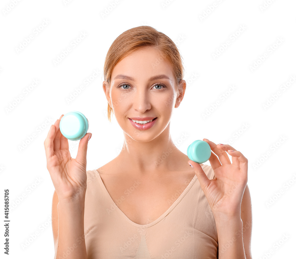 Beautiful young woman with facial cream on white background Beautiful young woman with facial cream on white background