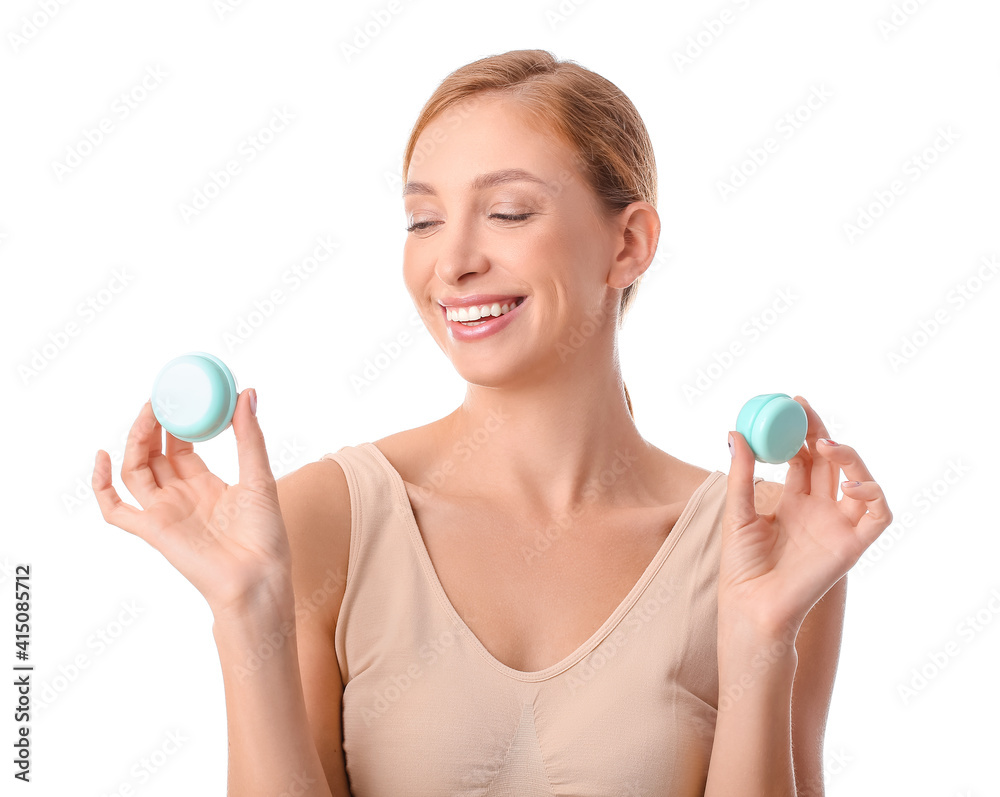 Beautiful young woman with facial cream on white background Beautiful young woman with facial cream on white background