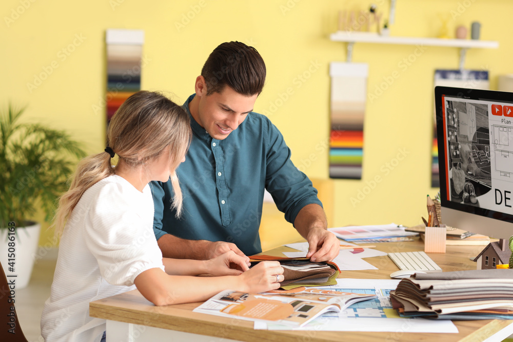 Male interior designer with client in his office Male interior designer with client in his office