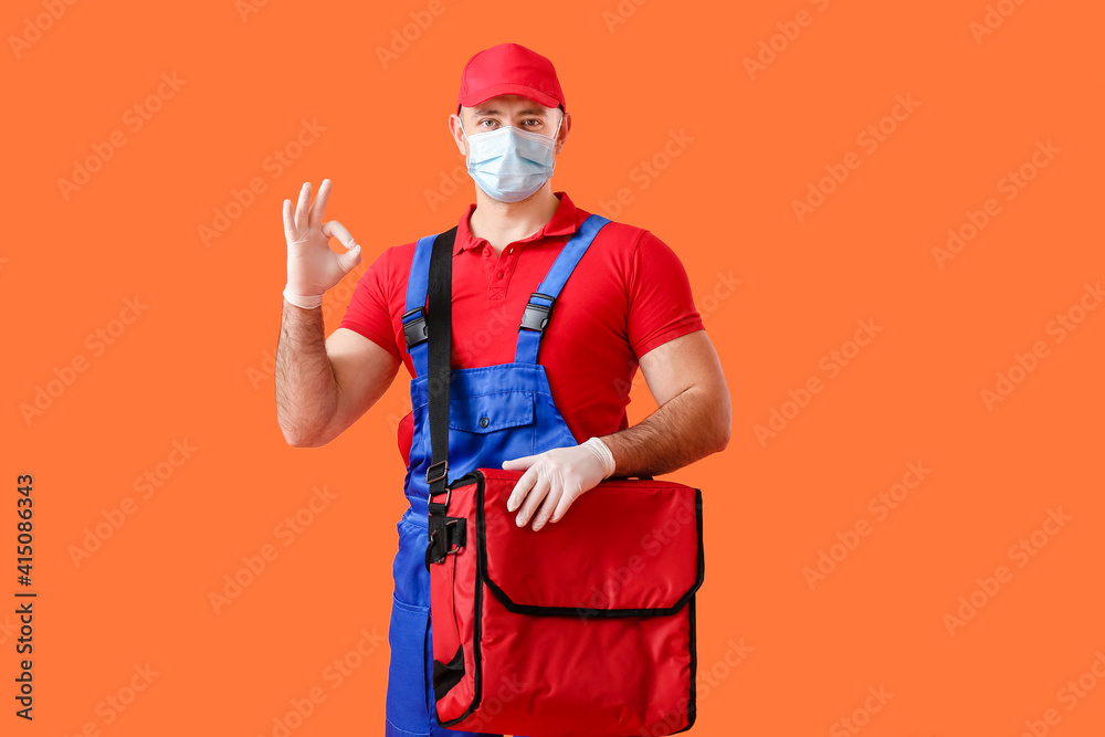 Courier of food delivery service showing OK on color background Courier of food delivery service showing OK on color background