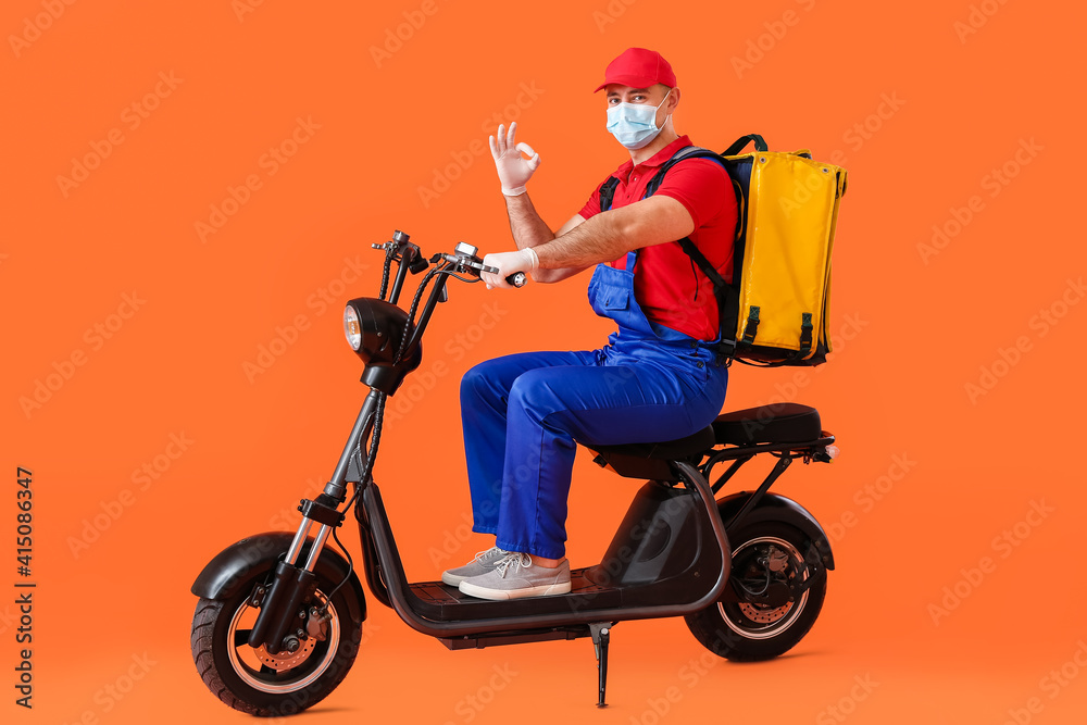 Courier of food delivery service showing OK on color background Courier of food delivery service showing OK on color background