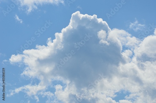 white cloud shapes on blue summer sky