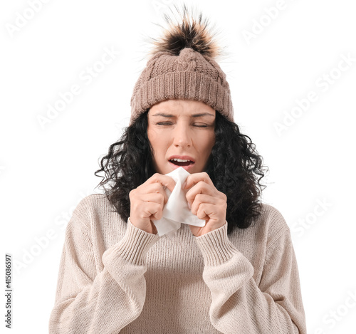 Sick young woman on white b...