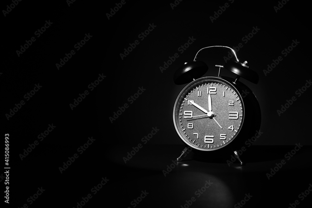 Alarm clock on black background Alarm clock on black background