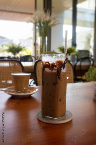 Iced chocolate mocha on wooden table