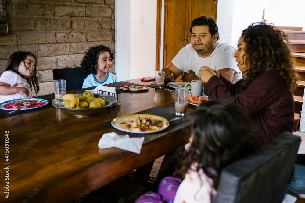latin family having breakfast at home in Latin America latin family having breakfast at home in Latin America