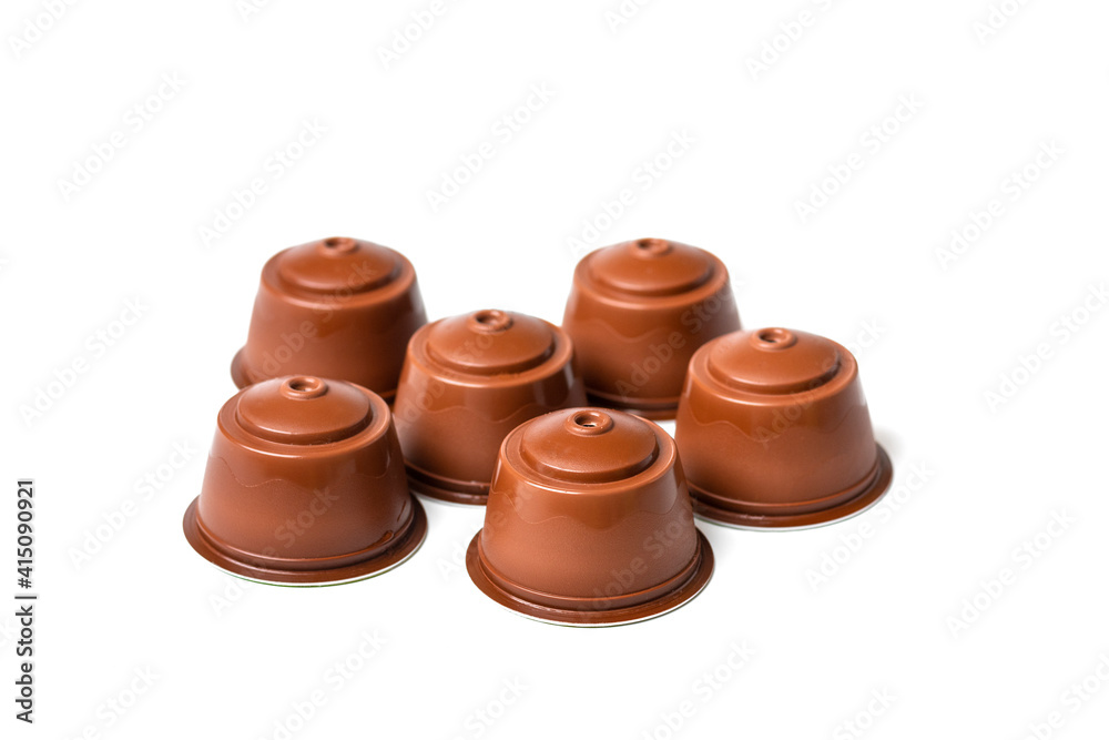 set of coffee capsules, roasted beans isolated on white background Top view Flat lay Drink obtained from dosed capsule with roasted, ground and compressed natural coffee set of coffee capsules, roasted beans isolated on white background Top view Flat lay Drink obtained from dosed capsule with roasted, ground and compressed natural coffee