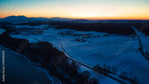 Sunset of a winter landscape with roads © Hanjin