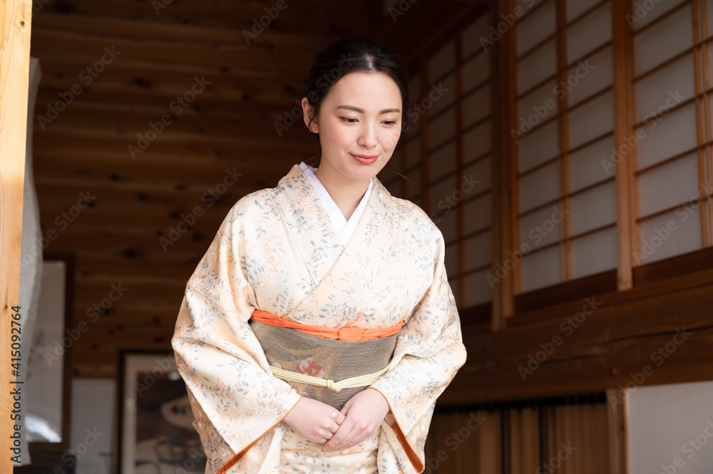 A beautiful Japanese woman offering hospitality. A beautiful Japanese woman offering hospitality.