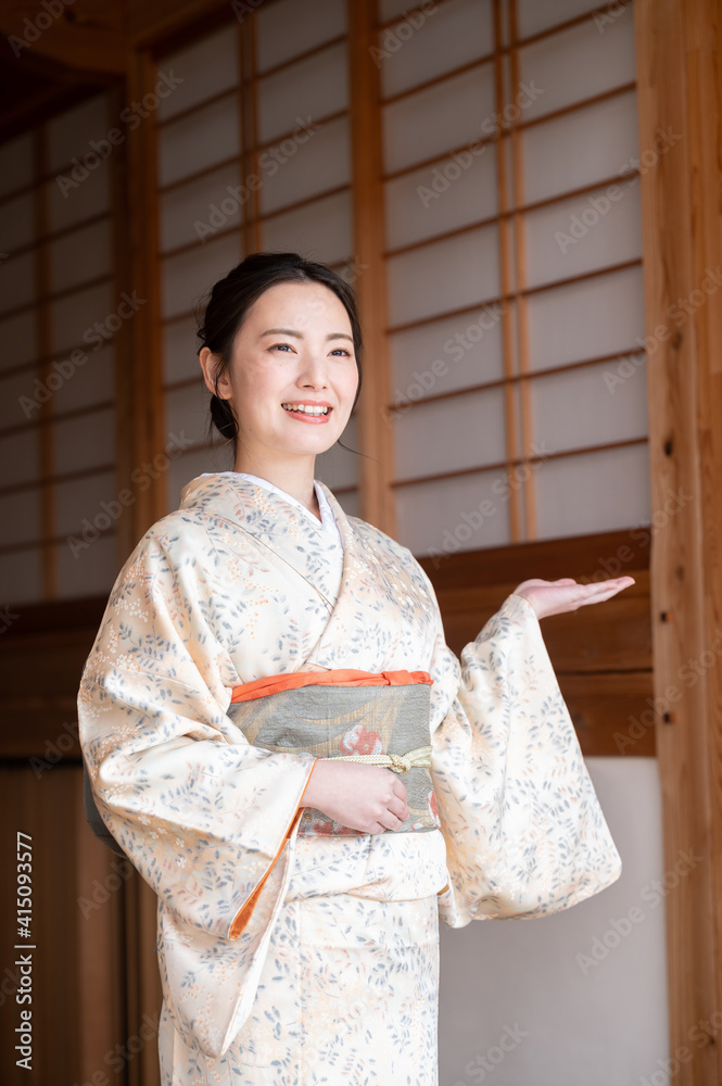 Vertical image of a beautiful young landlady, easy to use as a banner material for travel and inns. omotenashi, Vertical image of a beautiful young landlady, easy to use as a banner material for travel and inns. omotenashi,