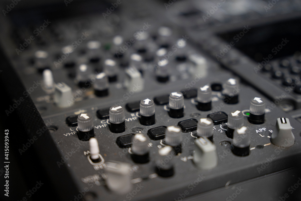 Close up on knobs of a commercial airplane radio panel. Close up on knobs of a commercial airplane radio panel.