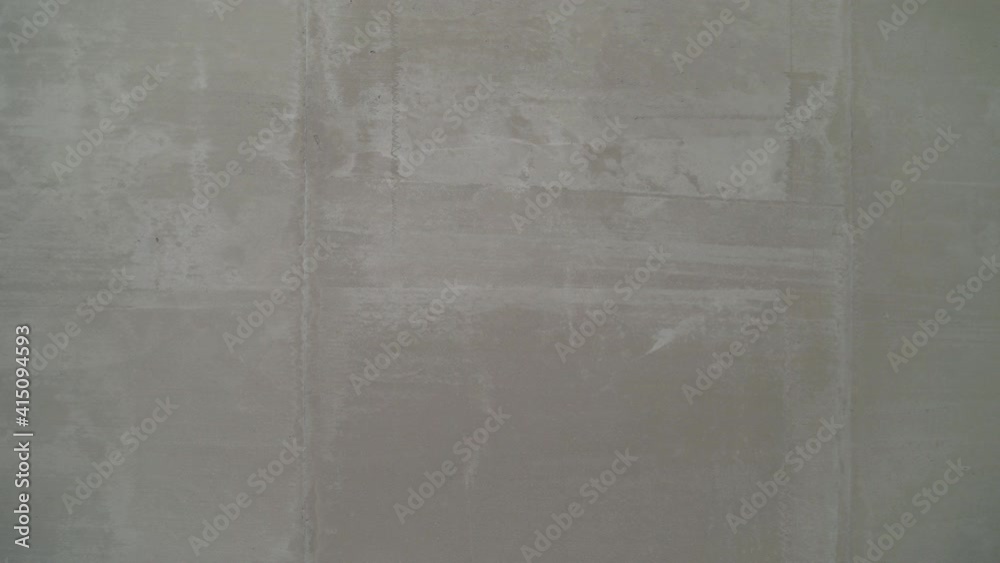Plastering wall. Texture of a wall made of gray mortar.