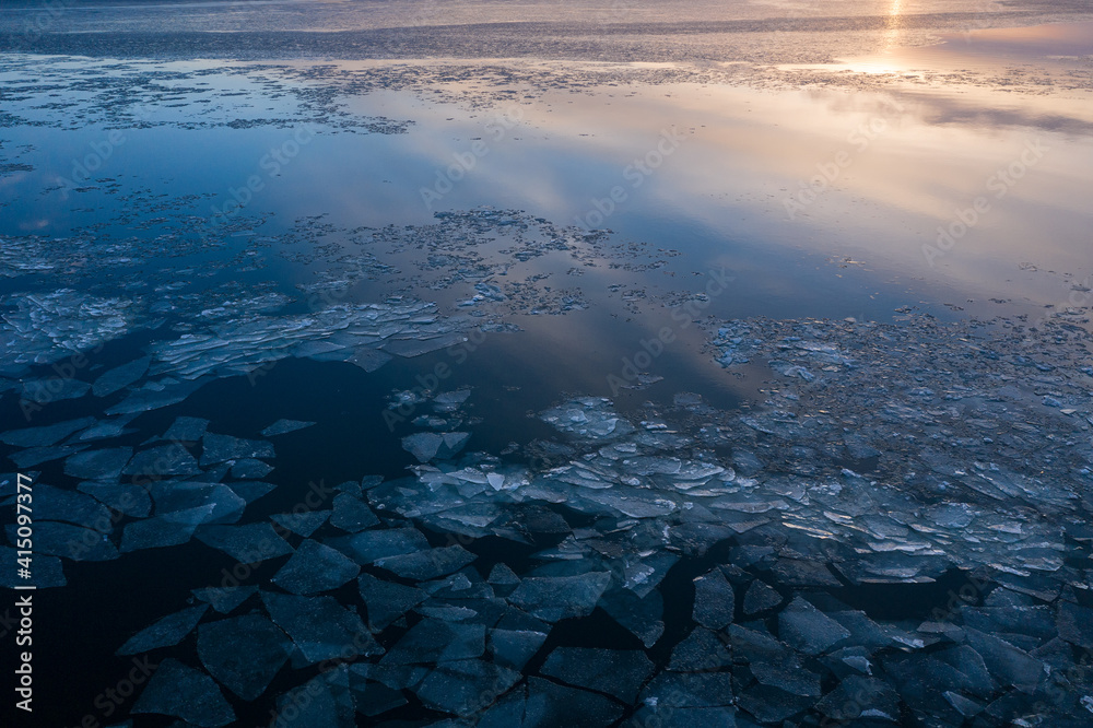 A tranquil scene of ice in a calm sea in the dawn