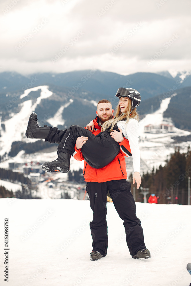 Couple in sport clothes. People spending winter vacation on mountains