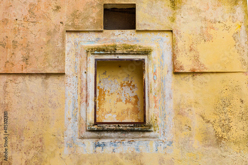 Italy, Basilicata, Province of Matera, Matera. Yellow wall and window. © Danita Delimont