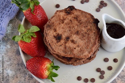 Double chocolate pancakes with fresh strawberries