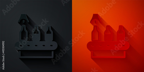 Paper cut Brewery factory production line pouring alcoholic drink in glass bottles icon isolated on black and red background. Paper art style. Vector.