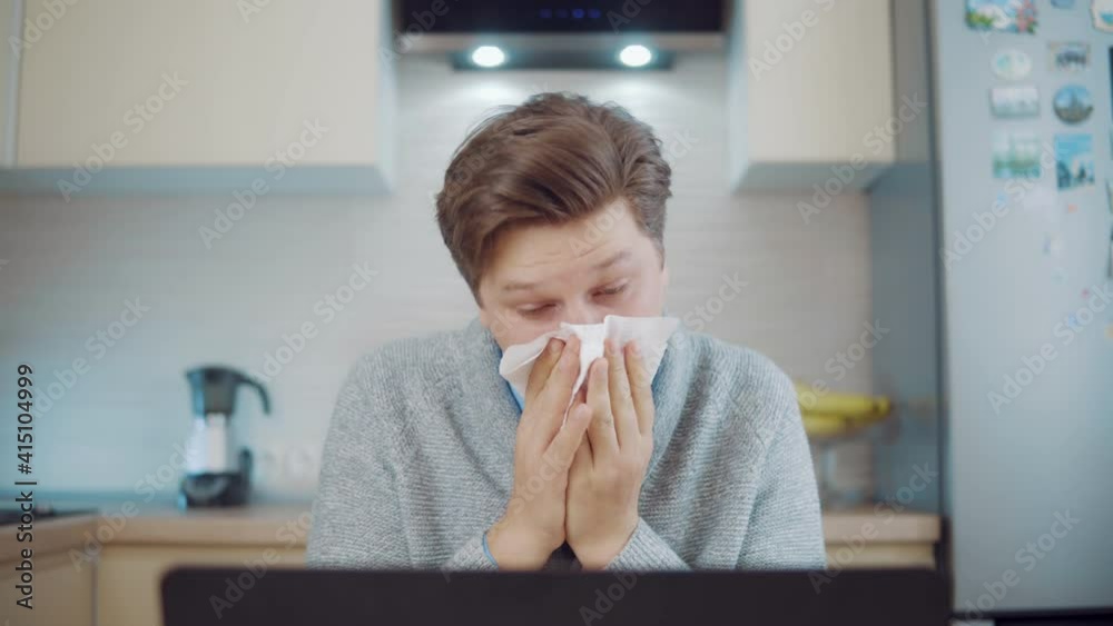 Runny nose. Young man having nose problems Runny nose. Young man having nose problems