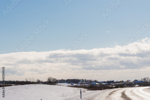 Winter road under blue sky.Rural road asphalt. © ARVD73